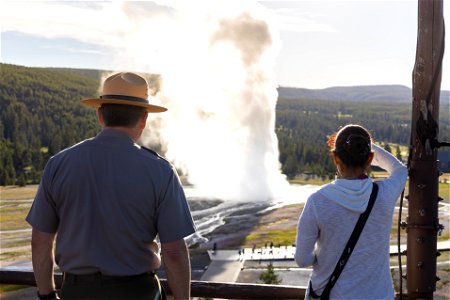 Yellowstone flood event 2022: Superintendent Cam Sholly and Secretary Haaland watching a morning eruption of Old Faithful