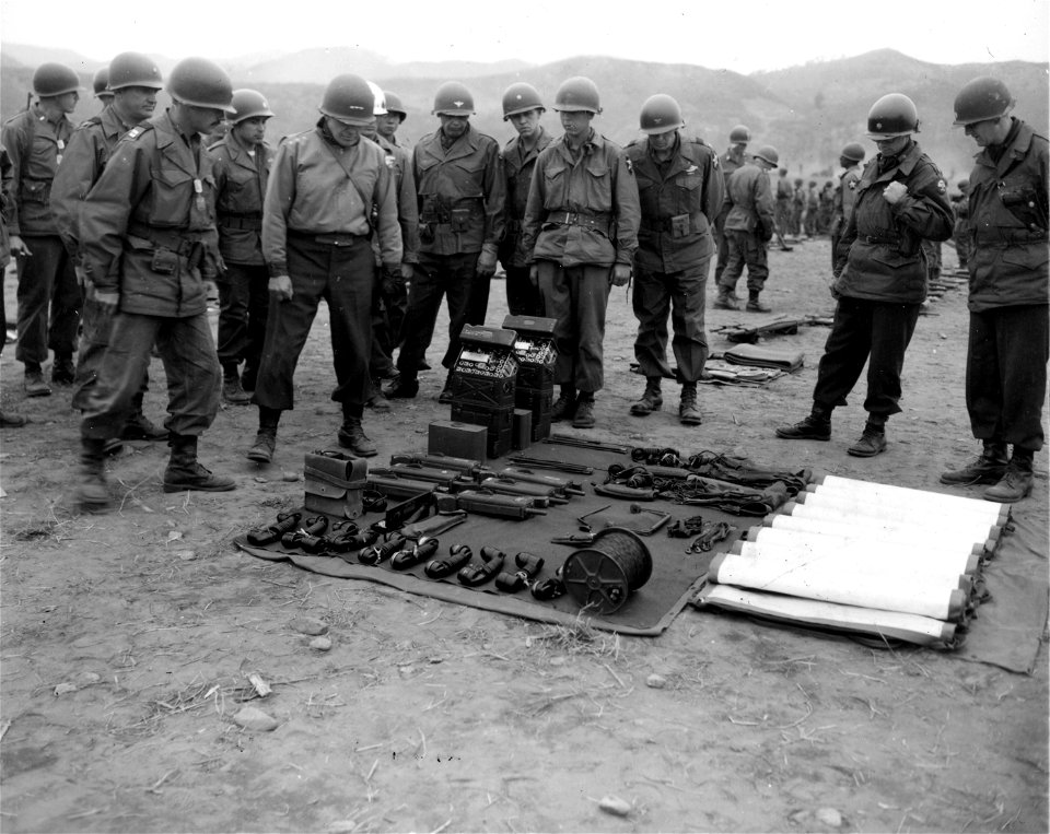 SC 364025 - Lt. Gen. Edward M Almond (2nd from Left) CG X Corps inspects telephone equipment of 2nd Bn., 9th RCT., 2nd Inf. Div...