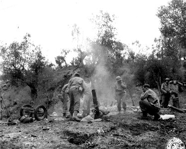 SC 336791 - Company B, 2nd Chemical Bn. The mortars are fired. The team is well trained and can fire 20 rounds a minute. Cassino area, Italy. 6 March, 1944.