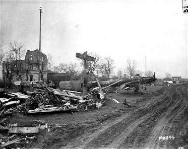 SC 198999 - Wrecked German planes are piled together in a graveyard at a German airfield in Metz, France. 20 December, 1944.