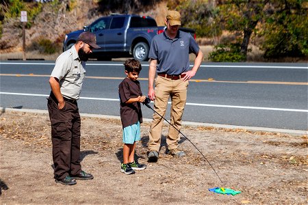 Attendees learn to cast with refuge staff