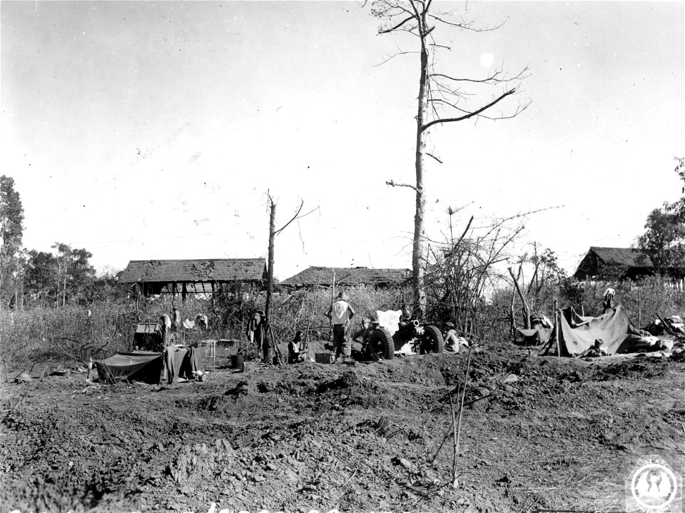 SC 364617 - A troop of the 366th Battery, 179th Regt., dug in on a Pinwe hill, 3.7 howitzer center.