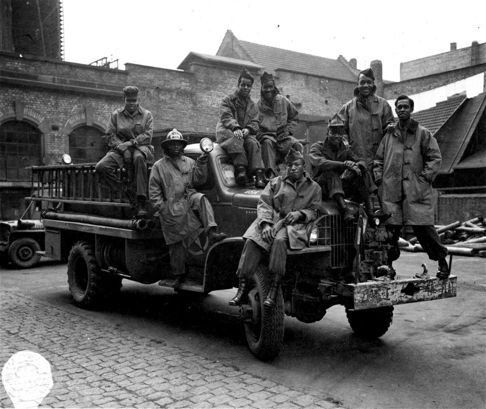 SC 364380 - Men of 2794th Eng. Fire-Fighting Platoon in Heidelberg, Germany on their fire truck. 21 January, 1946.