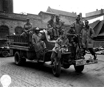 SC 364380 - Men of 2794th Eng. Fire-Fighting Platoon in Heidelberg, Germany on their fire truck. 21 January, 1946.