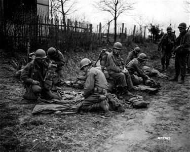 SC 374767 - Infantrymen prepare to move up to relieve the 100th Division, after the fall of the city of Bitche. 17 March, 1945. photo
