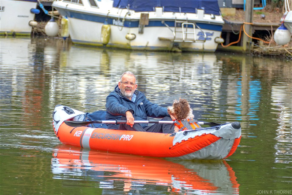 One man and his dog. Inflatable Canoe.