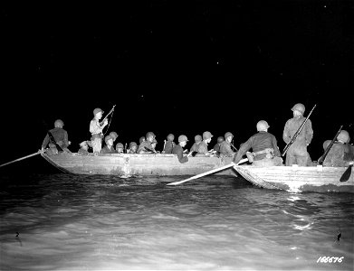 SC 166676 - Riflemen in an assault boat waiting for the signal to land during a night problem landing. Fitzroy River, Rockhampton, Australia. 19 November, 1942. photo