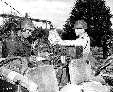 SC 179956 - L-R: Radio operator, Pfc. Floyd Dann, Indian, whose real name is Loma Tuchyoma, Tuba City, Ariz.; T/4 Glenn Lance, McLeansboro, Ill.;