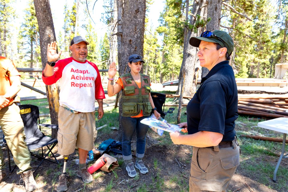 Sarah Davis, Chief Ranger, swears in two volunteers as Junior Rangers
