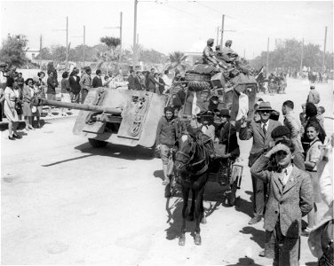 SC 171733 - Tunis townsfolk pour out along the highway to greet their deliverers. 1943. photo