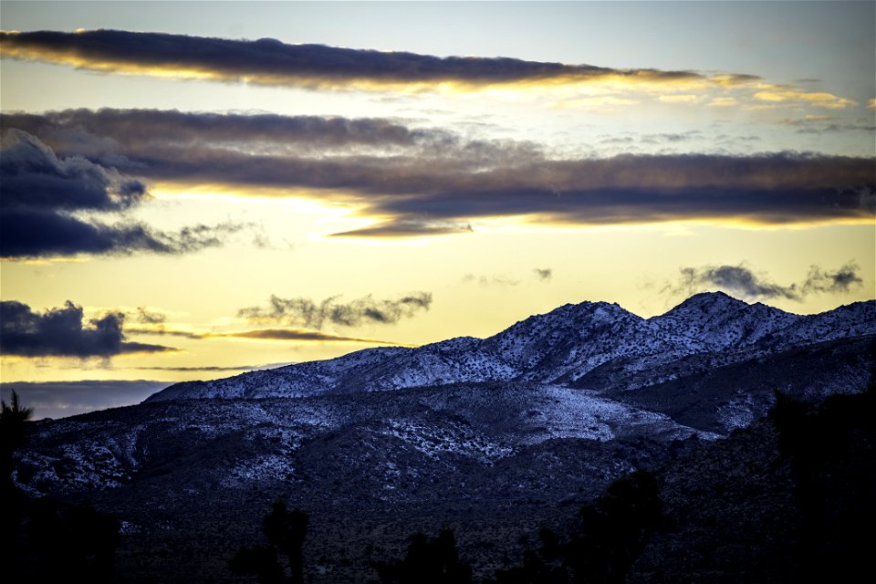 Clouds and snow over Lost Horse Valley at sunset
