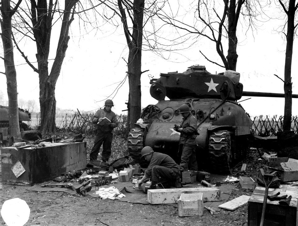 SC 221515 - Equipment in front of tank. Cpl. Harold S. Klampnauer, gunner, parents: Mr and Mrs. Henry J. 426 No. 16th St. Kansas City, Kansas.