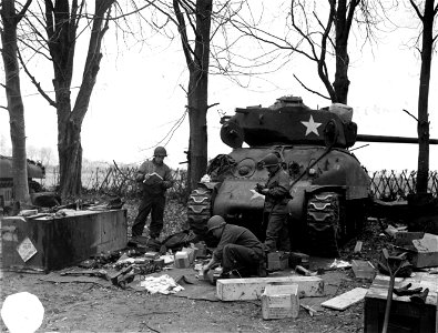 SC 221515 - Equipment in front of tank. Cpl. Harold S. Klampnauer, gunner, parents: Mr and Mrs. Henry J. 426 No. 16th St. Kansas City, Kansas.