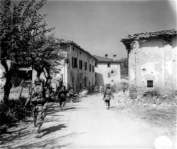 SC 270870 - Members of the 2nd Bn., 85th Mtn. Inf., 10th Mtn. Div., on the move through Badia. 19 April, 1945. photo