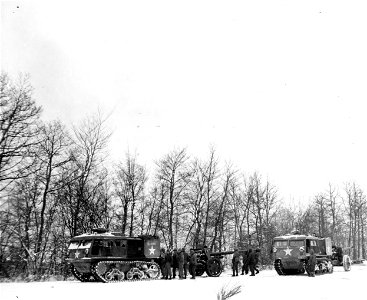 SC 199095 - M-4 tractors tow captured 88mm Nazi guns into place to be fired against Germans pocketed in the "bulge" between the 1st and 3rd U.S. Armies. Luxembourg. 11 January, 1945. photo
