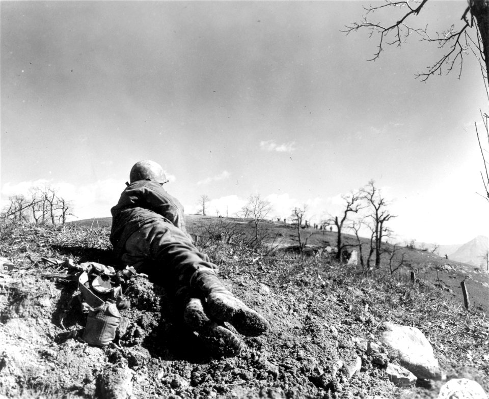 SC 270847 - Prisoners are flushed out of house by assault platoon of "K" Co., 87th Mtn. Inf., 10th Mtn. Div., during the attack on Monte Della Vedetta on the Poretta-Moderna Highway toward the Po Valley.