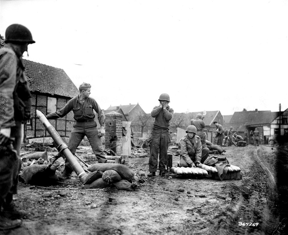 SC 364269 - Troops of the 87th Chemical Mortar firing on enemy tanks in close support of the 121st Regiment, 8th Infantry Division, First U.S. Army. 28 February, 1945.