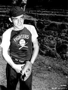 SC 151442- Bill Nolan of the “Fighters” smiles as he views his opponents in Hawaii. photo