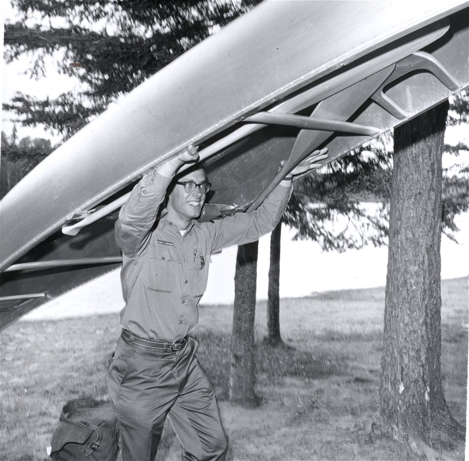 Ranger portaging canoe on Linda Bird Johnson Visit, 1965