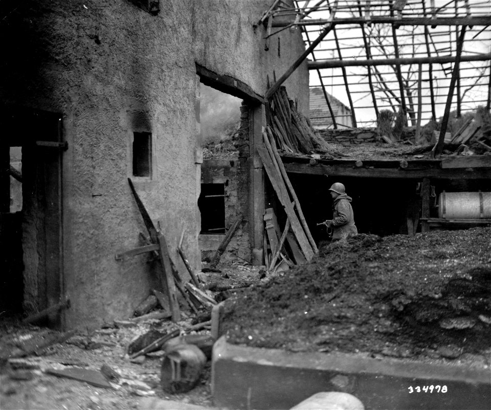 SC 334978 - Troops of the 10th Armored Division, 3rd U.S. Army, inspect ruins of newly-captured Irsch, Germany. 27 February, 1945.