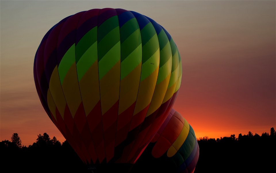Inflating hot air balloons at sunrise, central Oregon.