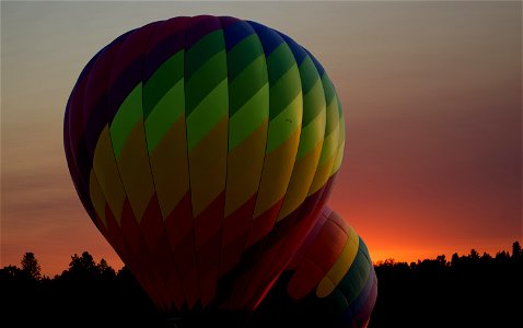 Inflating hot air balloons at sunrise, central Oregon. photo