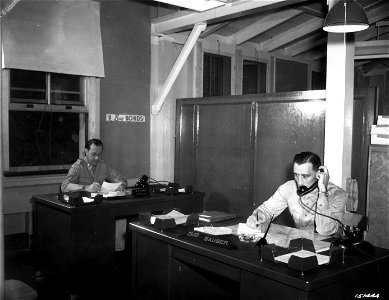 SC 151444 - Col. G. C. Ross and Major A. T. Sauser, the officers in charge of War Bond sales to officers and enlisted men of the Hawaiian Department, at work in the War Bond office, Hqtr. Haw. Dept., Fort Shafter, T.H.