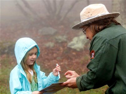 Child and Ranger on a Rainy Day