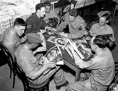 SC 396911 - English and American troops reading magazines sent overseas by the Special Services. photo