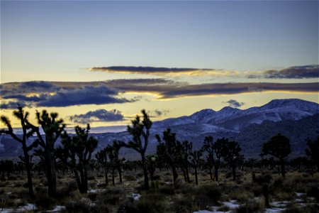 Clouds and snow over Lost Horse Valley at sunset photo