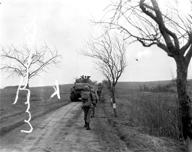SC 270834 - Tank destroyers[sic] attached to 9th Infantry Division of 1st U.S. Army roll towards Berg, Germany. 28 February, 1945.