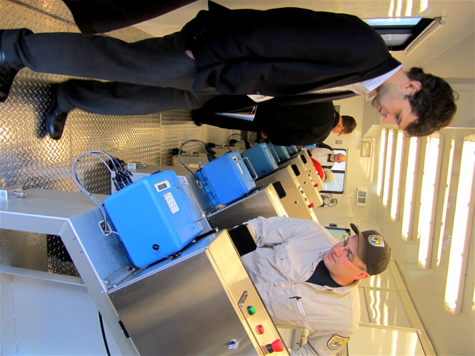 FWS biologist Jim Webster details fish processing line