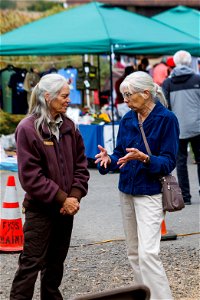 Attendees exchange words with refuge staff