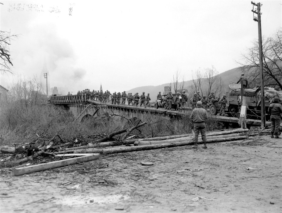 SC 270639 - Elements of 7th Inf. Regt. leave Gemunden after having taken part in assault on town yesterday. 6 April, 1945. photo