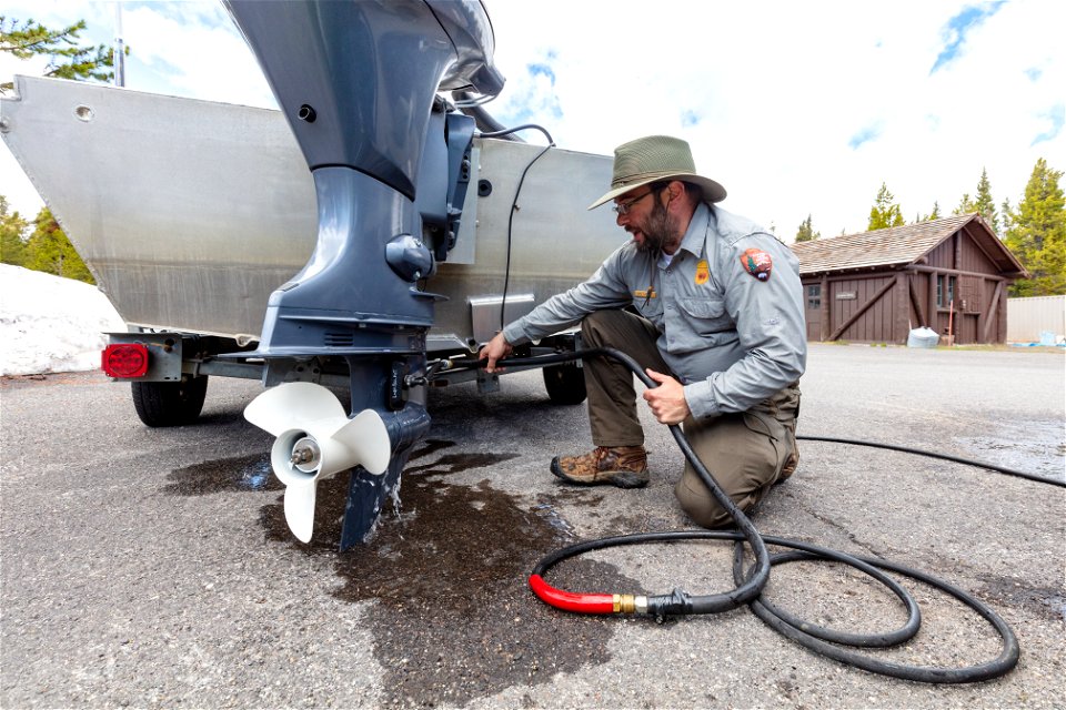 Mike Locatelli, Aquatic Invasive Species Biologist, flushing an engine