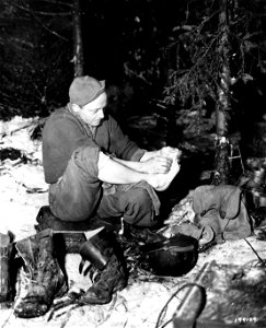 SC 199109 - Cpl. Lloyd C. Hood, Concordia, Kan., a member of the 101st Airborne Division, takes time out to wash his feet. photo