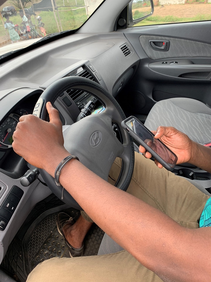 People handling portable steering wheel photo