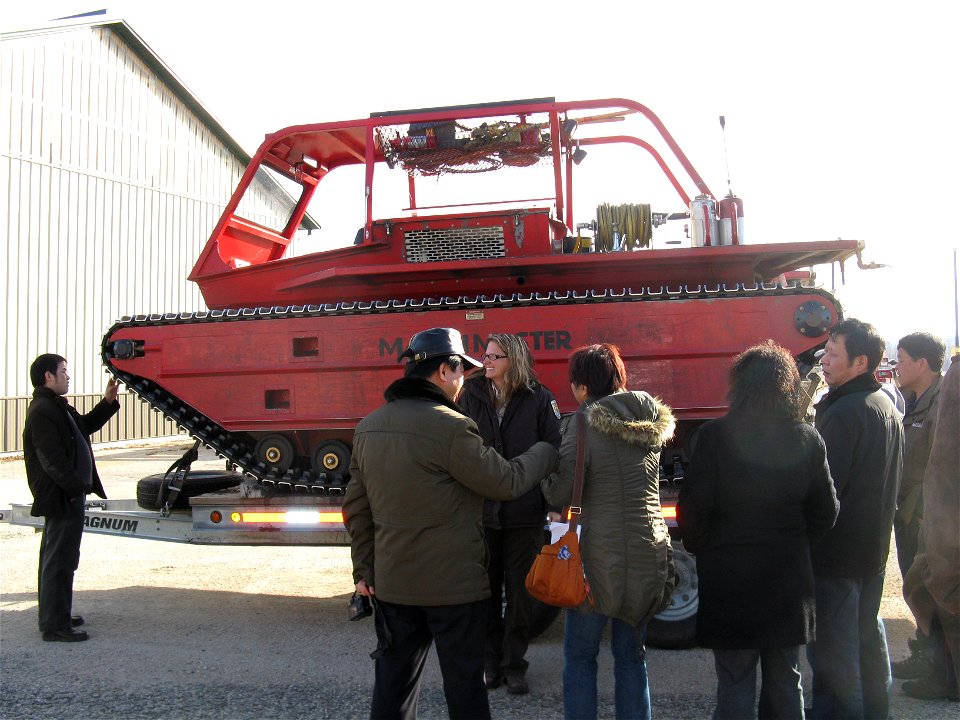 Biologist Wendy Woyczik shows marsh master as part of an equipment tour