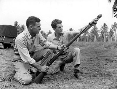 SC 364583 - Lt. Carl V. Earlin, Columbus, O., 737th Ord. Co., 37th Div., shown firing rifle grenade from the kneeling position.