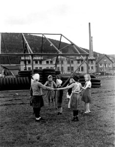 SC 405032 - Children of the Soviet Union whose parents were captured by the Germans and made to work in one of the German aircraft and rubber tire plants at Sanbach Odenwald, Germany, are shown playing a game. photo