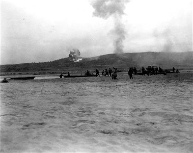 SC 348672 - Under supporting artillery fire, men of the 21st Inf. Regt. plunge across the Naktong River, as they advance against the enemy. photo