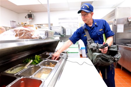 Commander George Larsen, Public Health Consultant, inspecting food services (3)