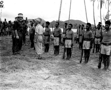 SC 364413 - Native Police boys, driven out of Salamaua by the Japs occupation, return to assist at ceremonies of returning to its masthead the Union Jack, which formerly flew over Salamaua. photo