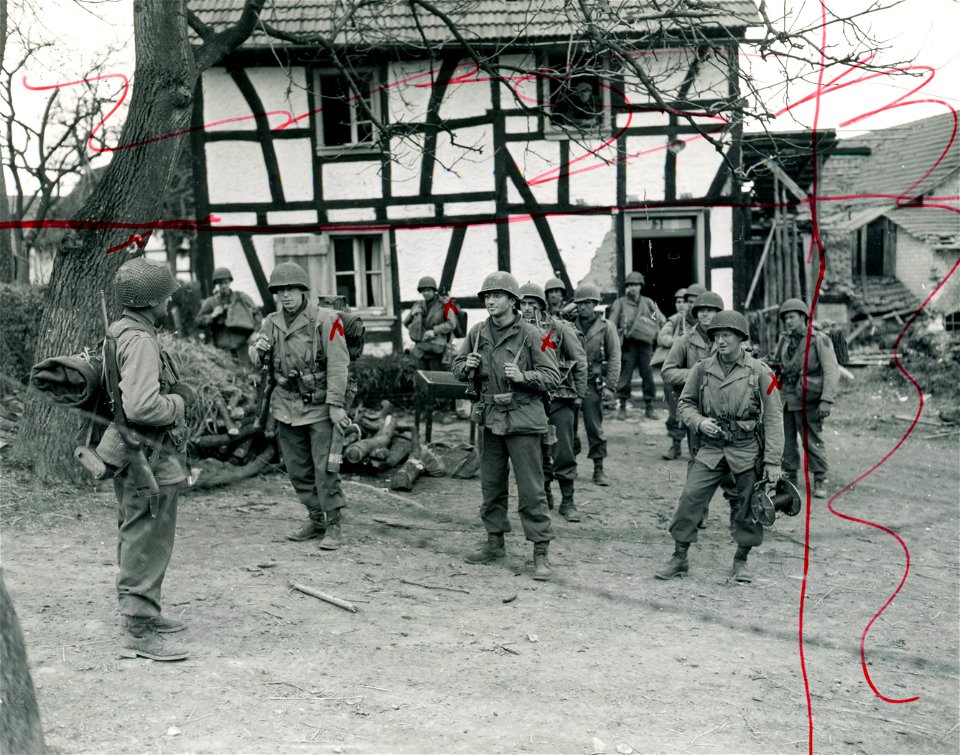 SC 374834 - Lt. Abraham J. Kownatsky, of 814 North 40th St., Phila., Pa., (left) and his 1st U.S. Army relief platoon prepare to leave Mittelscheid, Germany, to relieve another patrol located a mile from the town of Fernegierscheid.