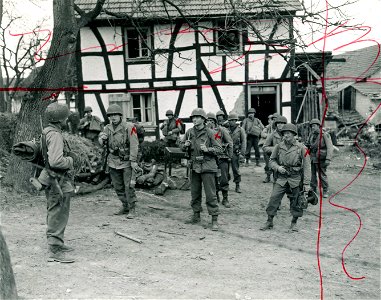 SC 374834 - Lt. Abraham J. Kownatsky, of 814 North 40th St., Phila., Pa., (left) and his 1st U.S. Army relief platoon prepare to leave Mittelscheid, Germany, to relieve another patrol located a mile from the town of Fernegierscheid. photo