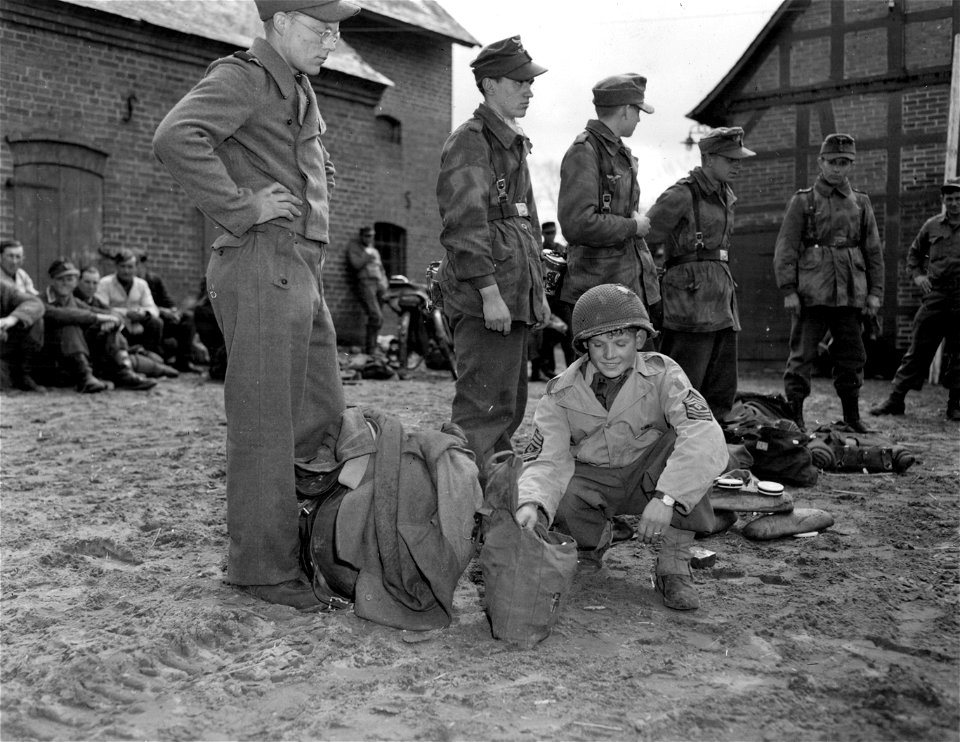 SC 405043 - Russian boy is adopted by Co F., 175th Infantry, 29th Infantry Division, Ninth U.S. Army as their mascot.