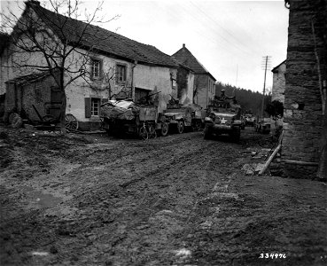 SC 334976 - Combat Command "B" of the 10th Armored Division, Third U.S. Army, move through the newly-captured Irsch, Gerrmany. 26 February, 1945. photo