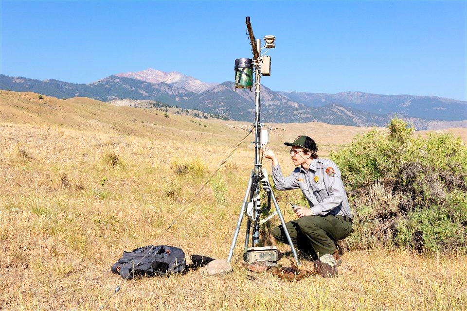 Ben Banet, GIS Technician, downlloading data from climate monitoring site