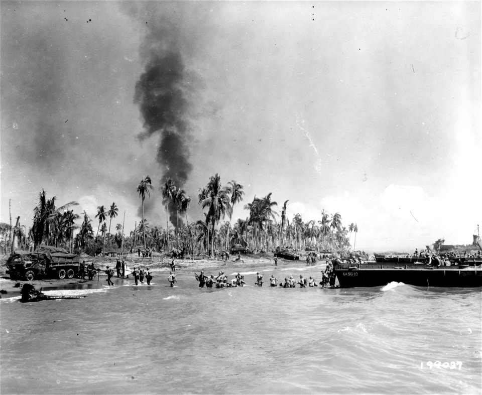 SC 199037 - American soldiers are shown passing supplies ashore from an LCVP at Leyte Island, P.I. 20 October, 1944.