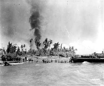 SC 199037 - American soldiers are shown passing supplies ashore from an LCVP at Leyte Island, P.I. 20 October, 1944.